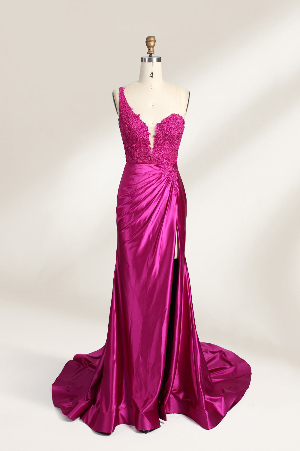 A mannequin displays a teal satin gown. It features a deep V - neckline with lace embroidery on the bodice, a ruched skirt, and a mermaid silhouette. The elegant details and shiny fabric create a glamorous look, perfect for formal events like proms or galas.8