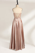 A mannequin showcases a champagne - satin gown. It has thin straps, a sheer lace - detailed bodice, and a voluminous skirt. The elegant design, blending satin and intricate lace, suits formal events like weddings, radiating sophistication.4