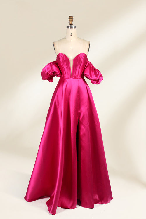 A mannequin showcases a magenta - satin gown. It has an off - the - shoulder, sweetheart neckline, puffed sleeves, and a high side slit. The elegant design, with smooth satin fabric, suits formal events like galas, radiating sophistication.1