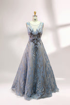 Presented on a mannequin is a gown with a gray base and rich red floral embroidery. It features a sheer neckline, a sleeveless design, and an intricate pattern that gives off a romantic and elegant vibe, perfect for formal events.3