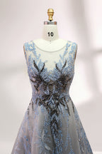 Presented on a mannequin is a gown with a gray base and rich red floral embroidery. It features a sheer neckline, a sleeveless design, and an intricate pattern that gives off a romantic and elegant vibe, perfect for formal events.6