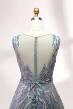 Presented on a mannequin is a gown with a gray base and rich red floral embroidery. It features a sheer neckline, a sleeveless design, and an intricate pattern that gives off a romantic and elegant vibe, perfect for formal events.10