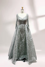 Showcased on a mannequin is a silver - gray evening gown. It has a V - neckline, long sleeves, and intricate lace embroidery all over. The elaborate design gives off a luxurious and elegant vibe, ideal for formal occasions.1