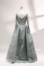Showcased on a mannequin is a silver - gray evening gown. It has a V - neckline, long sleeves, and intricate lace embroidery all over. The elaborate design gives off a luxurious and elegant vibe, ideal for formal occasions.2