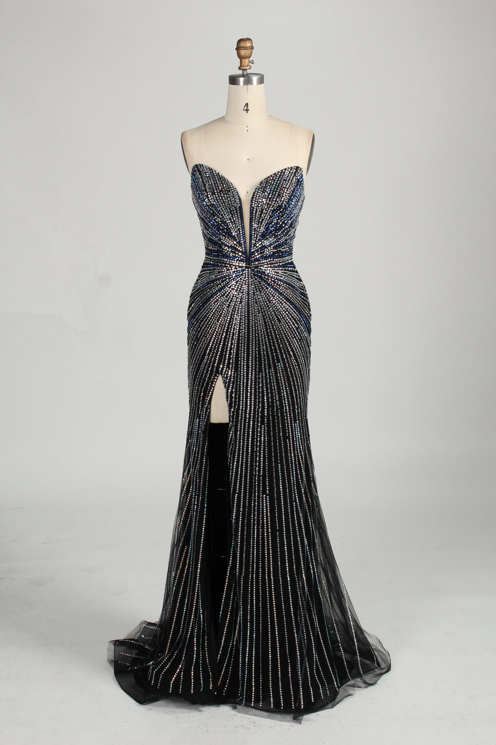 photo of a beautiful woman in a stunning blue ball gown with a plunging neckline and thigh-high slit, standing confidently in a studio with soft, diffused lighting, elegant and glamorous, full-length dress with intricate beadwork, long brunette hair styled in an elegant updo, fair skin, red lipstick, high heels, minimalist white background, fashion photography, stylish and sophisticated, no watermarks.KT1432-08