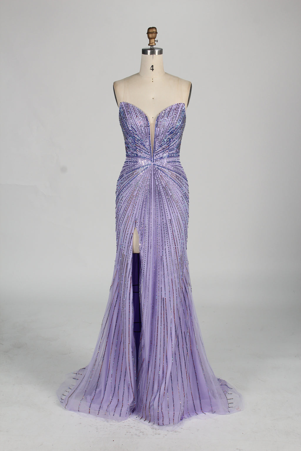 photo of a beautiful woman in a stunning blue ball gown with a plunging neckline and thigh-high slit, standing confidently in a studio with soft, diffused lighting, elegant and glamorous, full-length dress with intricate beadwork, long brunette hair styled in an elegant updo, fair skin, red lipstick, high heels, minimalist white background, fashion photography, stylish and sophisticated, no watermarks.KT1432-10