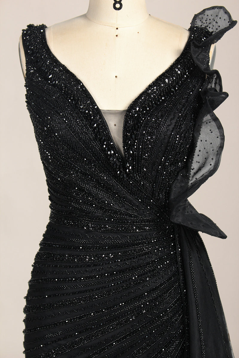 photograph of a mannequin wearing a stunning black evening gown, full-length, sleeveless, deep V-neck, intricate beadwork, flowing chiffon skirt, elegant, sophisticated, fashion, haute couture, runway model, high fashion, elegant design, detailed textures, luxurious, black and white, fashion photography, studio setting, plain background, soft lighting, shadow play, chic, elegant, classy, high-end fashion, glamour, haute couture fashion, evening wear.MC124-02
