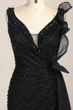 photograph of a mannequin wearing a stunning black evening gown, full-length, sleeveless, deep V-neck, intricate beadwork, flowing chiffon skirt, elegant, sophisticated, fashion, haute couture, runway model, high fashion, elegant design, detailed textures, luxurious, black and white, fashion photography, studio setting, plain background, soft lighting, shadow play, chic, elegant, classy, high-end fashion, glamour, haute couture fashion, evening wear.MC124-02