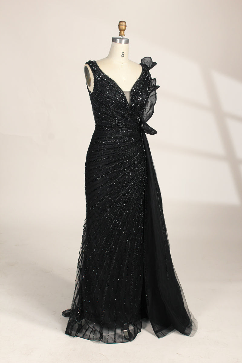 photograph of a mannequin wearing a stunning black evening gown, full-length, sleeveless, deep V-neck, intricate beadwork, flowing chiffon skirt, elegant, sophisticated, fashion, haute couture, runway model, high fashion, elegant design, detailed textures, luxurious, black and white, fashion photography, studio setting, plain background, soft lighting, shadow play, chic, elegant, classy, high-end fashion, glamour, haute couture fashion, evening wear.MC124-03