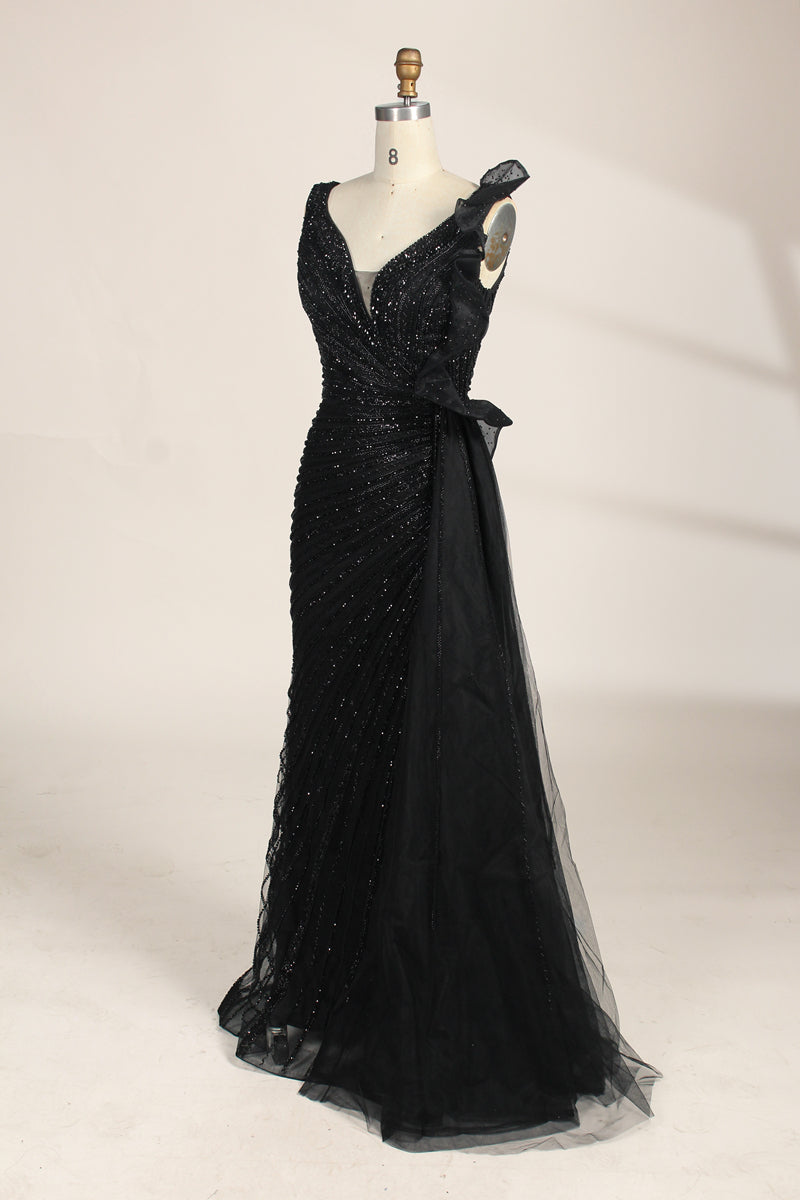 photograph of a mannequin wearing a stunning black evening gown, full-length, sleeveless, deep V-neck, intricate beadwork, flowing chiffon skirt, elegant, sophisticated, fashion, haute couture, runway model, high fashion, elegant design, detailed textures, luxurious, black and white, fashion photography, studio setting, plain background, soft lighting, shadow play, chic, elegant, classy, high-end fashion, glamour, haute couture fashion, evening wear.MC124-04