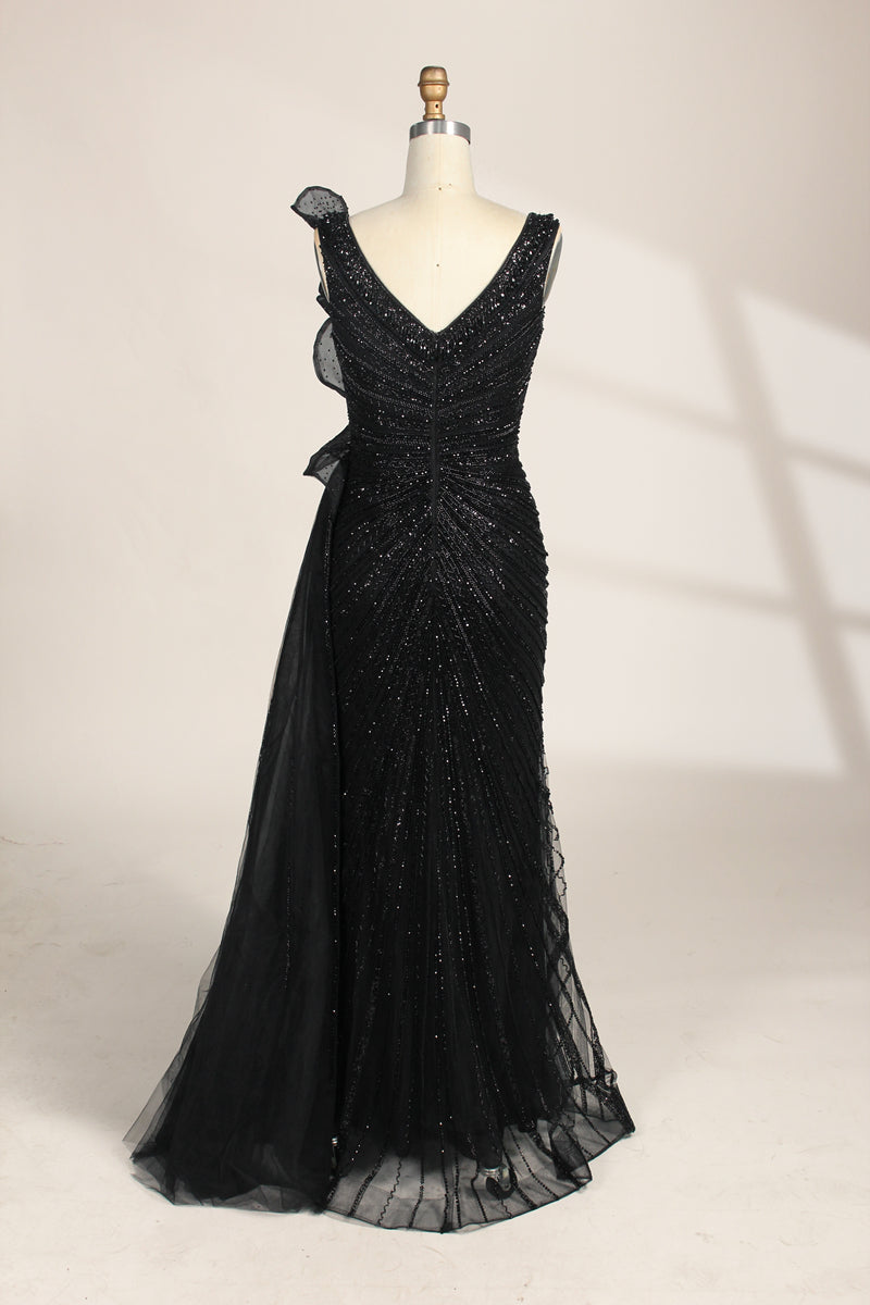 photograph of a mannequin wearing a stunning black evening gown, full-length, sleeveless, deep V-neck, intricate beadwork, flowing chiffon skirt, elegant, sophisticated, fashion, haute couture, runway model, high fashion, elegant design, detailed textures, luxurious, black and white, fashion photography, studio setting, plain background, soft lighting, shadow play, chic, elegant, classy, high-end fashion, glamour, haute couture fashion, evening wear.MC124-05