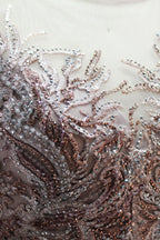 Presented on a mannequin is a deep - red evening gown. It features a sheer neckline, long billowy sleeves, and intricate gold - toned embroidery throughout. The elaborate design gives off a luxurious and elegant vibe, ideal for formal occasions.6