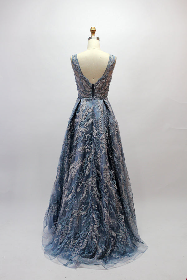 Presented on a mannequin is a mauve evening gown. It features a deep V - neckline, intricate floral embroidery with bead accents, and a flowing skirt. The elegant design creates a romantic and sophisticated look, perfect for formal events.3