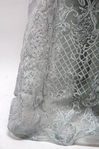 Showcased on a mannequin is a silver - gray evening gown. It has a V - neckline, long sleeves, and intricate lace embroidery all over. The elaborate design gives off a luxurious and elegant vibe, ideal for formal occasions.9