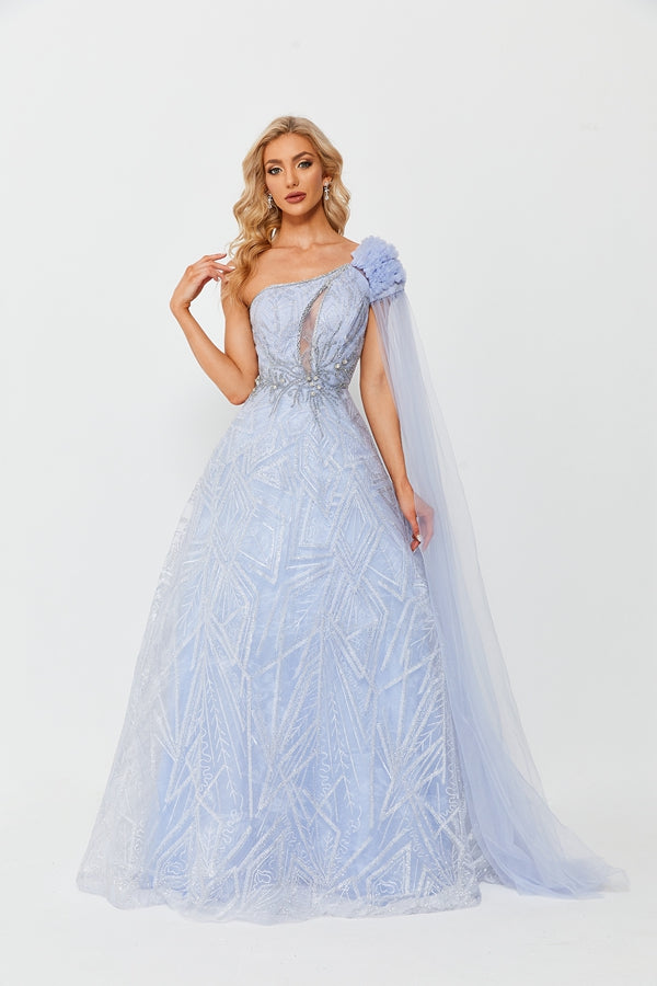 A beautiful blonde woman in a light blue, lace, one-shoulder gown with intricate geometric patterns, standing against a plain white background, elegant, classy, soft lighting, long wavy hair, fair skin, delicate features, serene expression, bridal gown, fashion photography, full-length shot, romantic, feminine, ethereal, dreamy atmosphere, high-end fashion, sophisticated style, elegant posture, refined taste, soft pastel colors