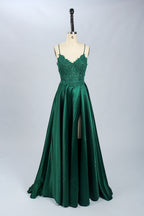Displayed on a mannequin is a burgundy gown. It features spaghetti straps, a lace - adorned bodice, and a flowing chiffon skirt with a slit. The elegant design suits formal events like galas or weddings.7