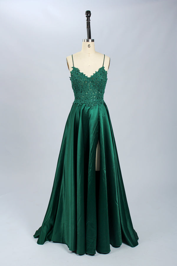 Displayed on a mannequin is a burgundy gown. It features spaghetti straps, a lace - adorned bodice, and a flowing chiffon skirt with a slit. The elegant design suits formal events like galas or weddings.7