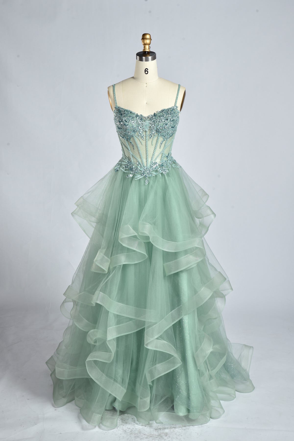 Sage green corset strap prom dress with layered ruffle tulle skirt