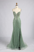 Sage green strapless mermaid prom dress with beaded bodice and flowing skirt