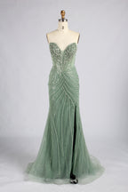 Sage green strapless mermaid prom dress with beaded bodice and flowing skirt