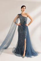 Bathed in soft light, a woman graces the scene in a navy - blue sequined one - shoulder gown. It’s adorned with feather details, a flowing tulle cape, and a high side slit. The mermaid silhouette, shimmering with sequins, exudes opulence, perfect for grand galas or red - carpet moments.1
